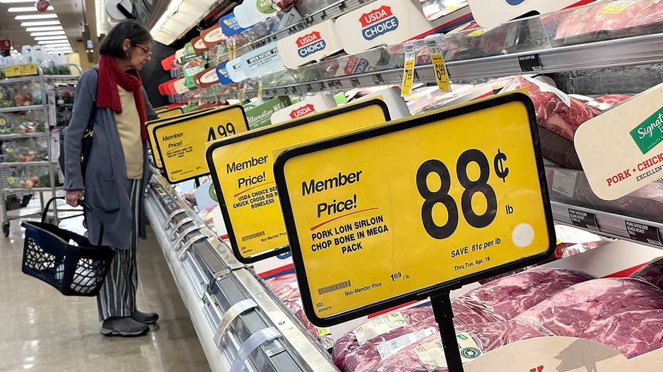 A customer shops for meat at a Safeway store